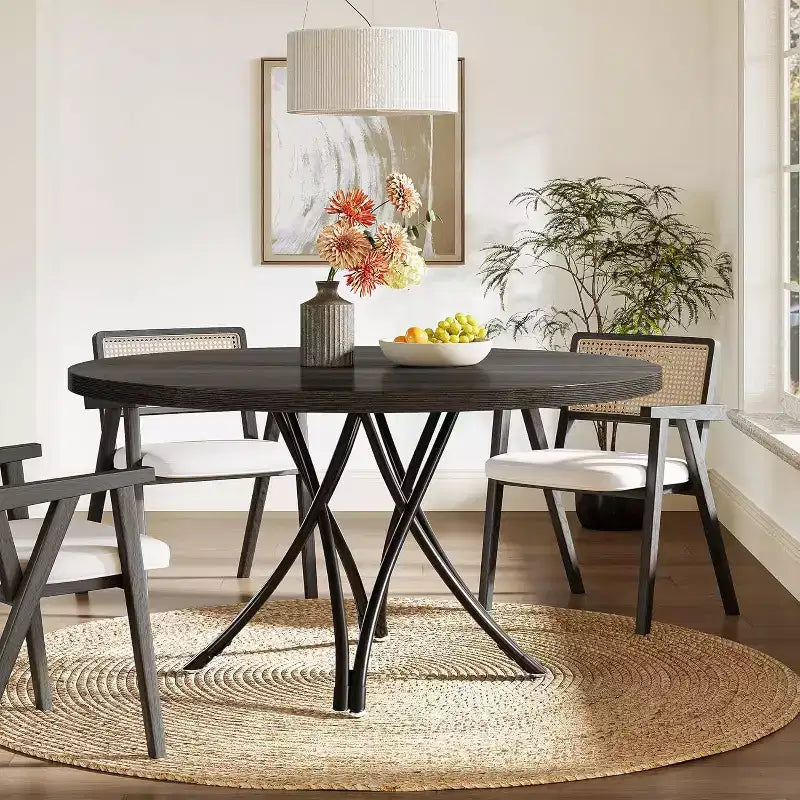 Tavolo da pranzo moderno rotondo da 120 cm per 4 persone, piano in legno nero con gambe in metallo incrociate