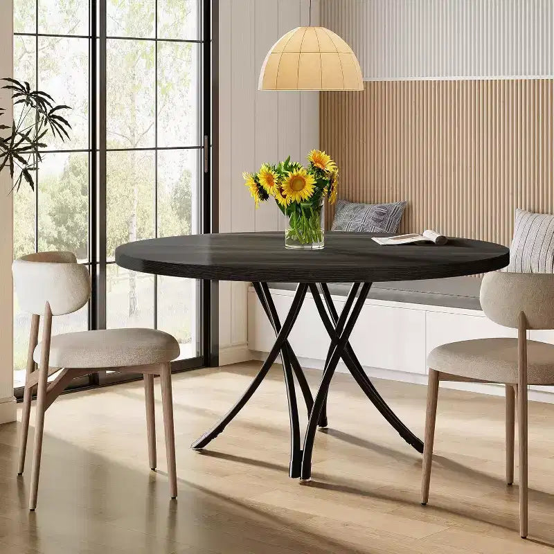 Tavolo da pranzo moderno rotondo da 120 cm per 4 persone, piano in legno nero con gambe in metallo incrociate