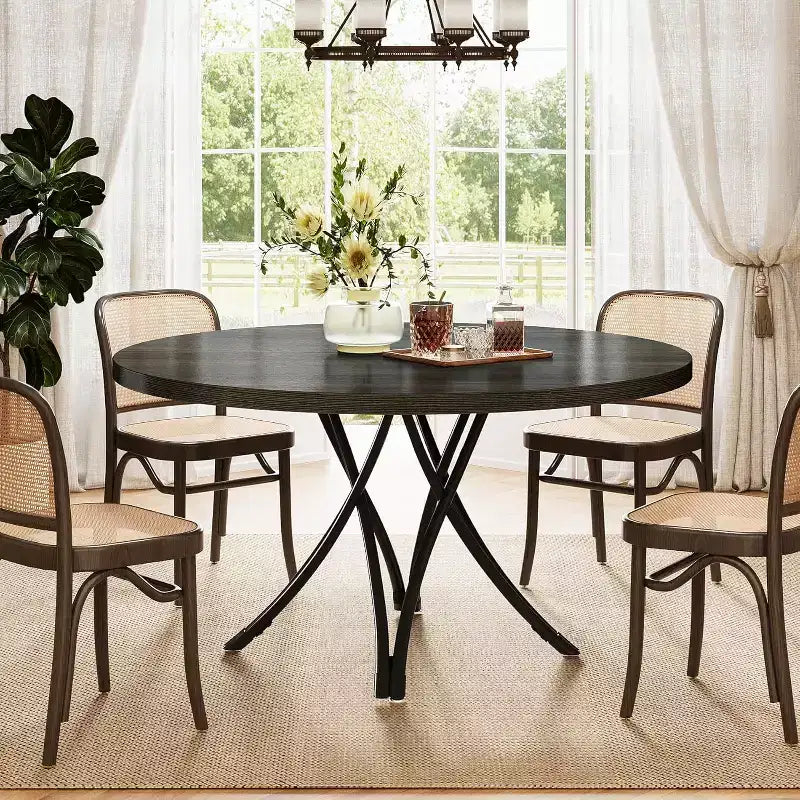 Tavolo da pranzo moderno rotondo da 120 cm per 4 persone, piano in legno nero con gambe in metallo incrociate
